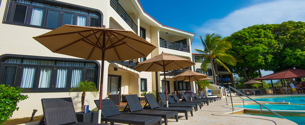 The Royal Suites Poolside Lounge Area